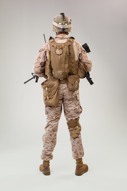 Rear view of military soldier US army marines operator studio shot portrait