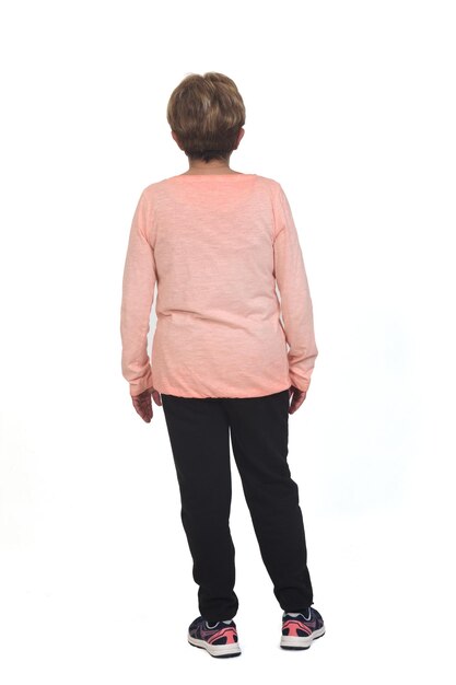 Rear view o f a full portrait of senior woman with sportswear on white background