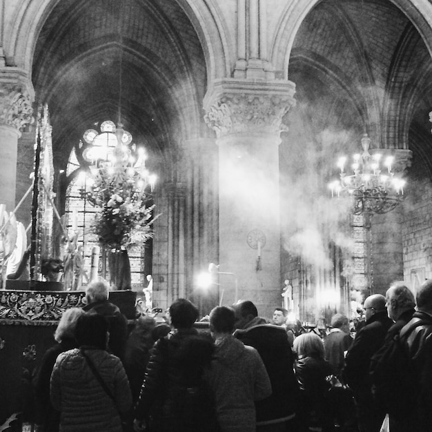 Photo rear view of people in church