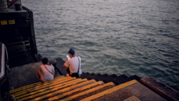 Rear view of people looking at sea