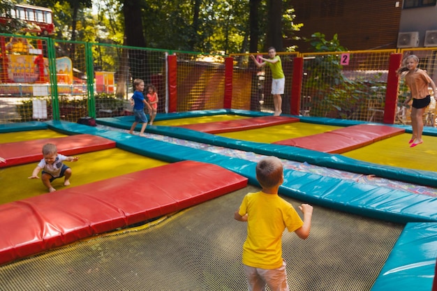 Rear view of people playing on playground