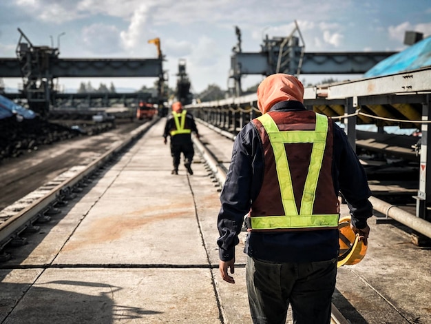 rear view of people on railroad track