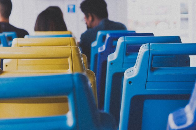 Rear view of people sitting on chair