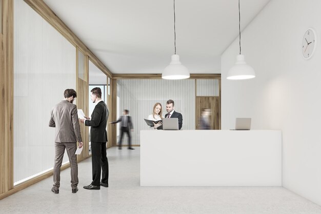 Photo rear view of people talking and walking near the reception desk