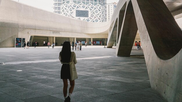 Rear view of people walking in city