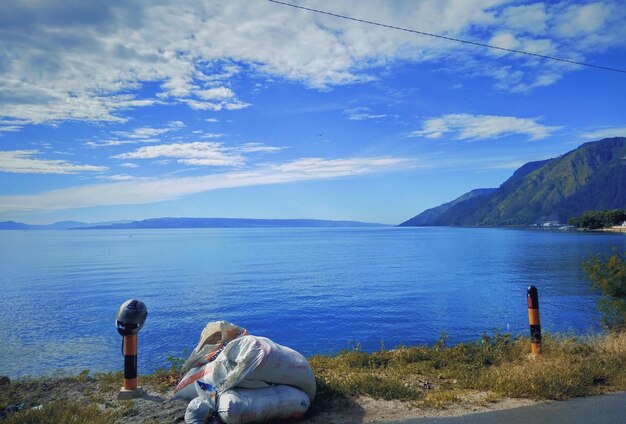 Rear view of sea against sky