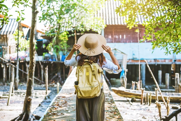 Rear view of senior woman standing in park