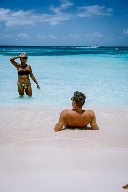 Rear view of shirtless man on beach