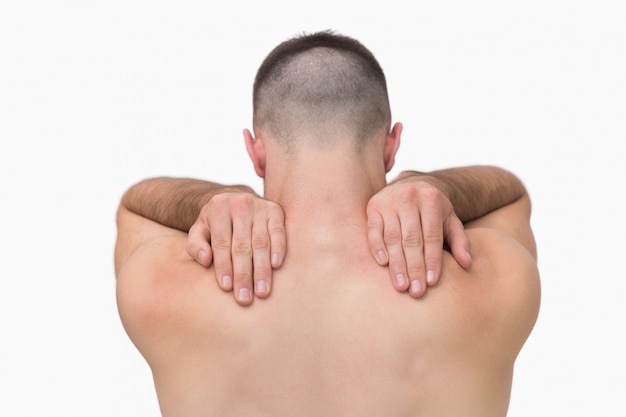 Photo rear view of shirtless man with shoulder pain