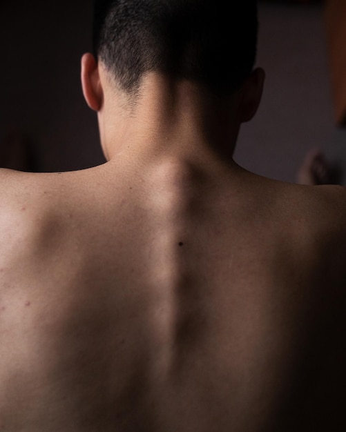 rear view of shirtless man