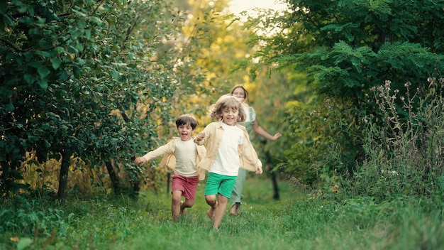 rear view of siblings walking on field