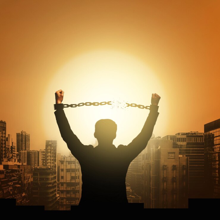फोटो rear view of silhouette man against cityscape during sunset