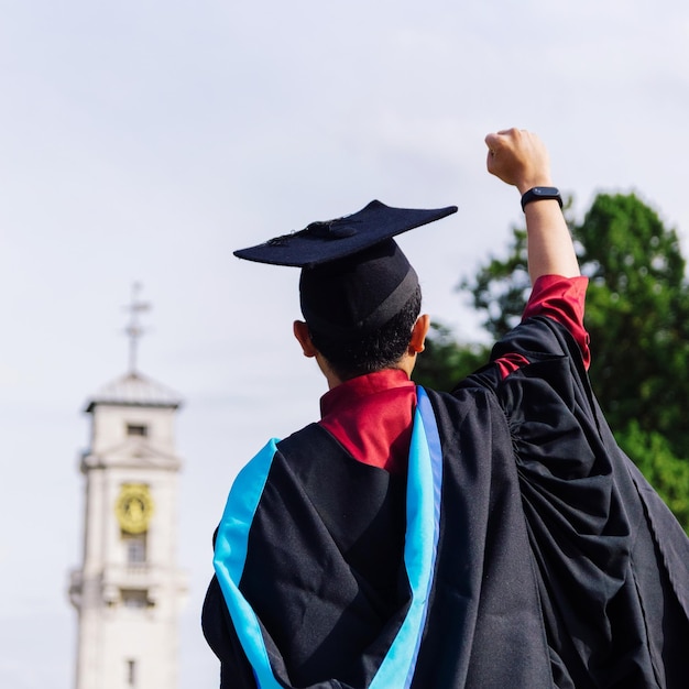 rear view of student wearing graduation gown