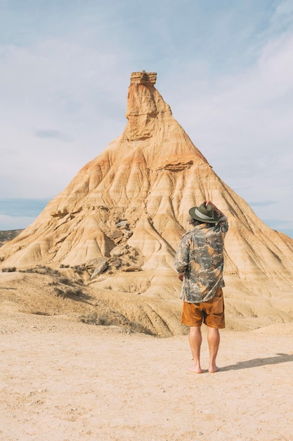 Rear View Of A Traveler Exploring In The Navarre Desert