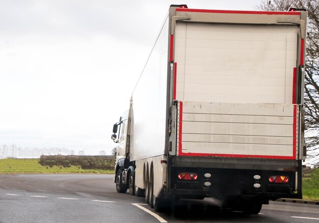 Rear view of a truck on road against sky