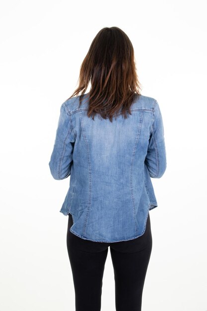 Rear view of unrecognizable young woman with long dark hair back isolated white background in studio shot lady back behind view