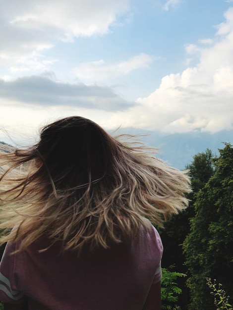 Rear view of woman against sea