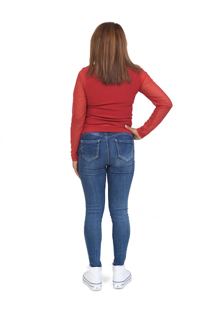 Rear view of a woman hand on hip on white background