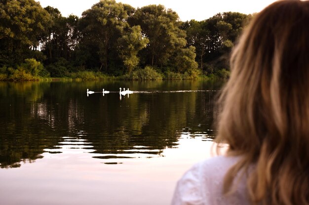 Rear view of woman looking at lake