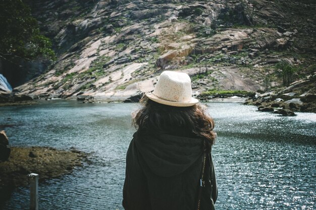 Rear view of woman looking at river