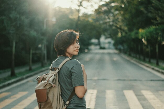 Rear view of a woman on road