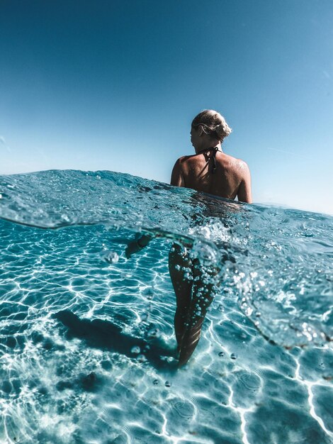 Rear view of woman in sea