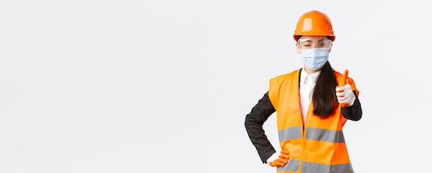 Rear view of woman standing against white background