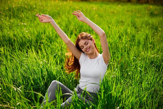 Rear view of woman standing on grassy field