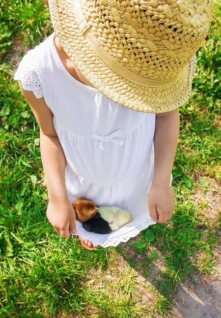 Rear view of woman standing on grassy field