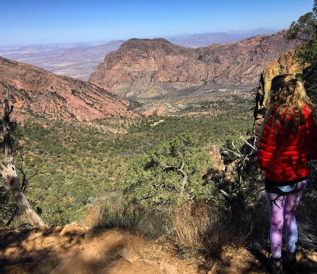 Rear view of woman standing on mountain at big bend national park