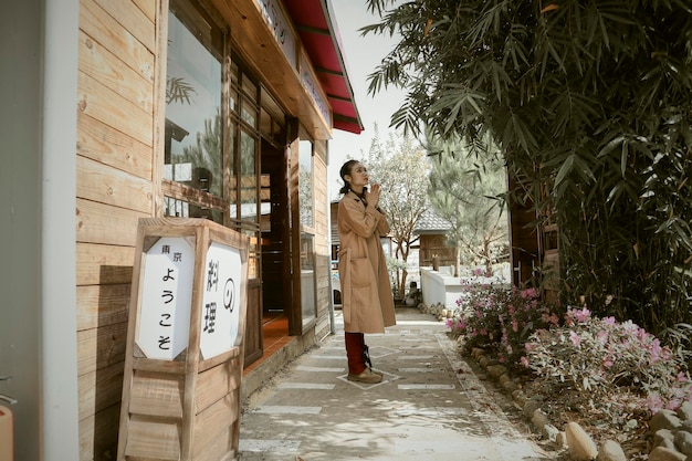 Rear view of woman standing in park