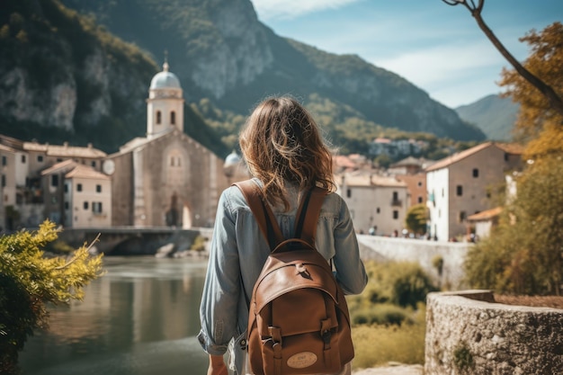 Rear view of woman tourist enjoying beautiful village