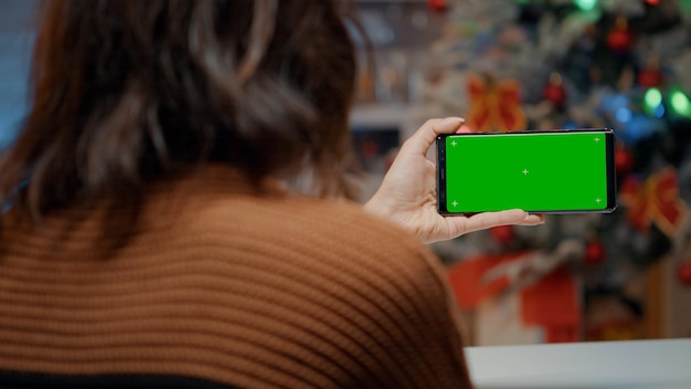 rear view of woman using mobile phone