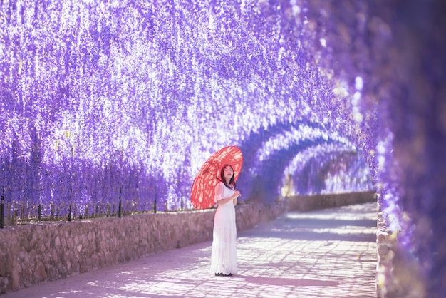 Rear view of woman walking on road