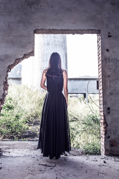 Rear view of woman wearing a black dress