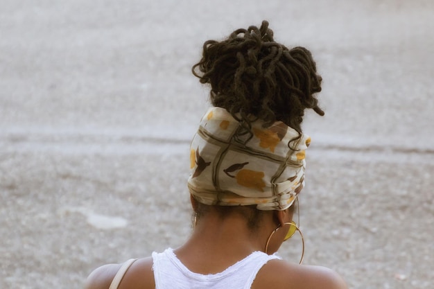 Rear view of woman wearing headscarf on street