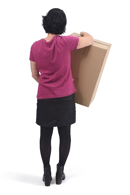 Rear view of  woman with package on white background