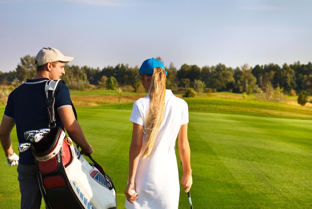 Rear view of women on golf course