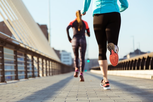 Rear view of women running