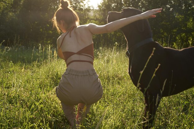 Rear view of women standing on field