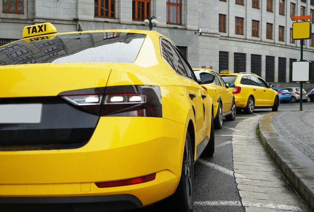 Rear view of yellow taxi on street