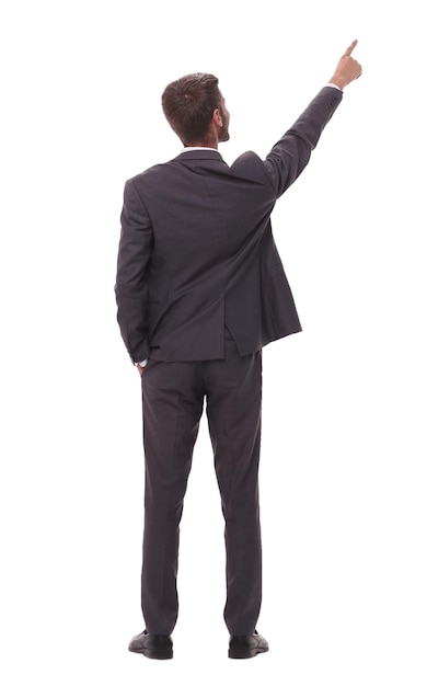 Rear view young businessman pointing to copy spaceisolated on white background