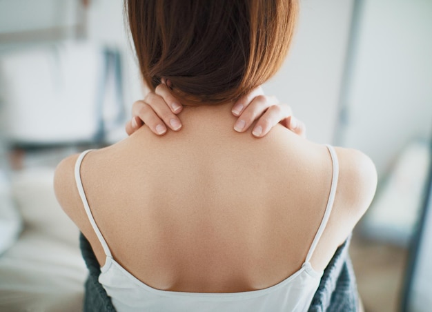 rear view of young woman at home