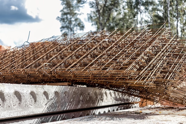 Rebar reinforcing bars or steel close up reinforcement steel\
wires mesh of steel used as a tension device in reinforced\
concrete