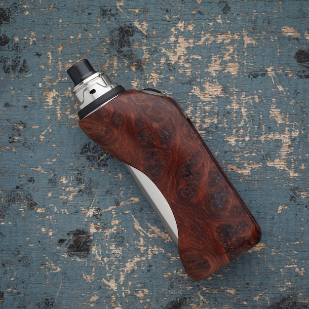 rebuildable dripping atomizer with stabilized natural redwood burl regulated box mods on an old paint wood texture background, vaping device, selective focus