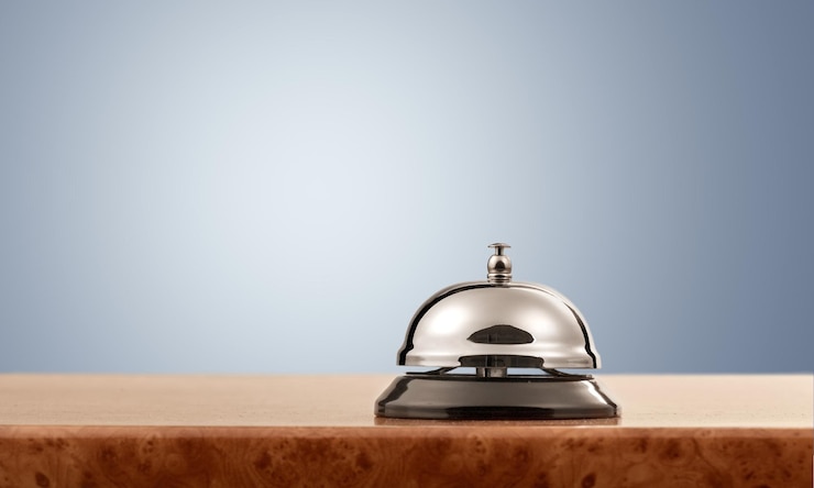 Photo reception service desk bell on blurred background