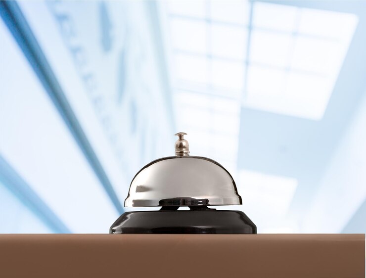 Photo reception service desk bell on blurred background