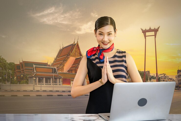 Photo receptionist doing sawasdee pose which is the hospitality culture thai style