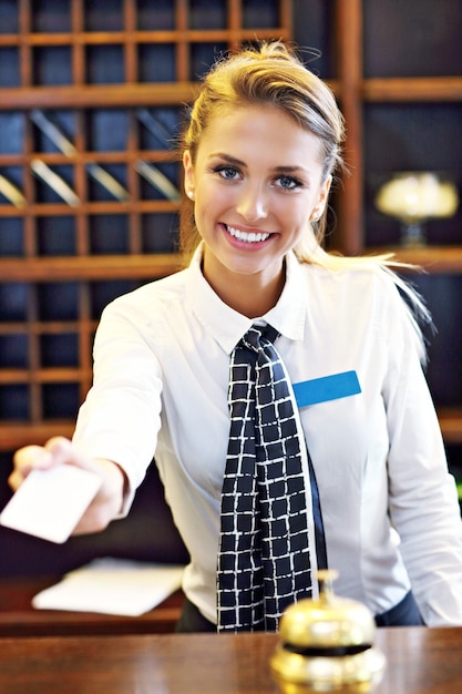 receptionist giving key card