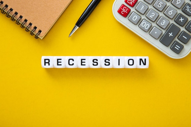 Recession word on yellow background